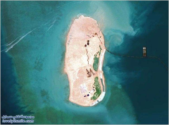 الصين تبني جزيرة كبيرة في المياه المتنازع عليها